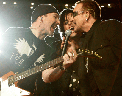 The Edge performs with Green Day front man Billy Joe Armstrong and Bono at halftime of the Falcons-Saints game. (USA Today images)