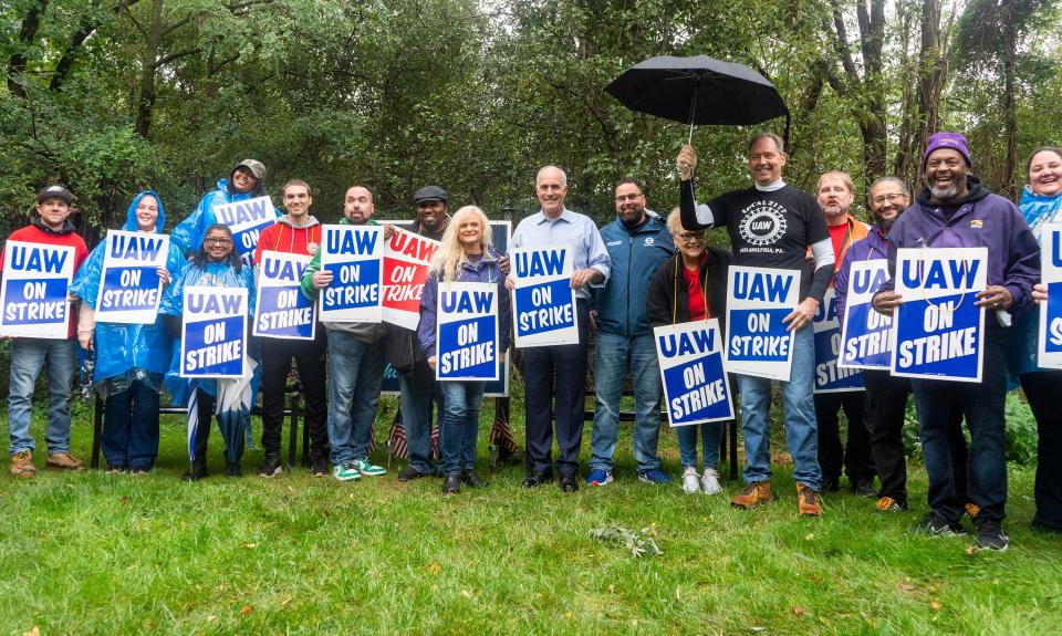 Sen. Bob Casey, center, poses for a picture during his visit to local auto workers and their supporting union members on strike outside General Motors Corp. in Langhorne on Tuesday, Sept. 26, 2023.

[Daniella Heminghaus | Bucks County Courier Times]