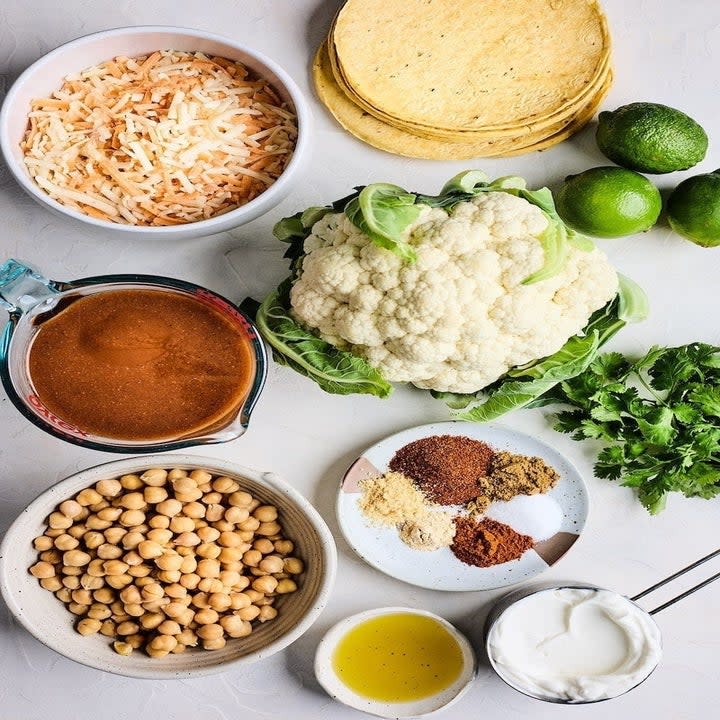 ingredients for cauliflower enchiladas laid flat on a table