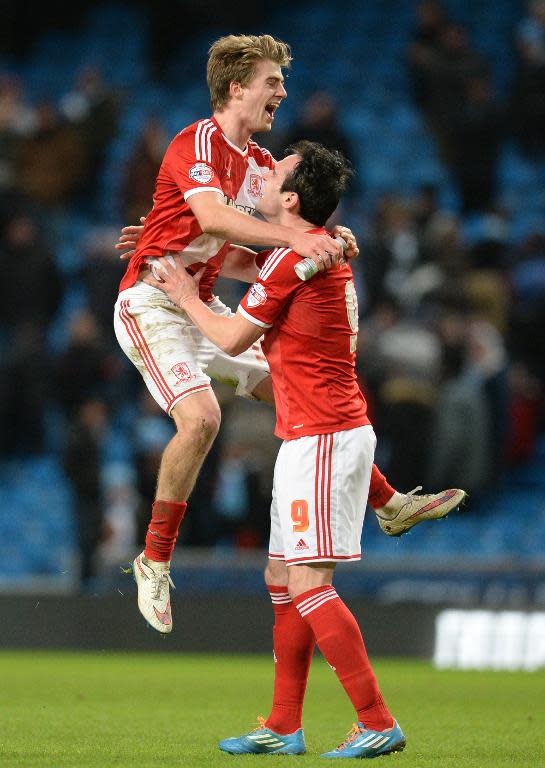 Goalscorers Middlesbrough's Kike (R) and Patrick Bamford celebrate at the final whistle in the FA Cup fourth round football match between Manchester City and Middlesbrough in Manchester, England, on January 24, 2015