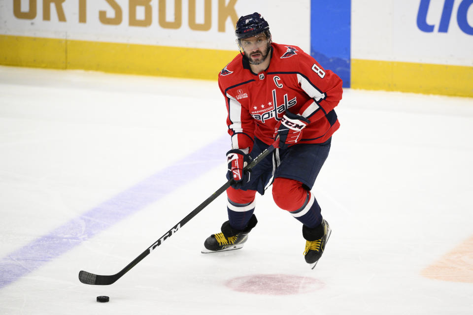 Washington Capitals left wing Alex Ovechkin skates with the puck during the third period of the team's NHL hockey game against the Pittsburgh Penguins, Thursday, Jan. 26, 2023, in Washington. The Capitals won 3-2 in a shootout. (AP Photo/Nick Wass)