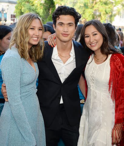 <p>Broadimage Entertainment / Alamy </p> Charles Melton and sisters at the premiere of 'The Sun Is Also a Star' on May 13, 2019.