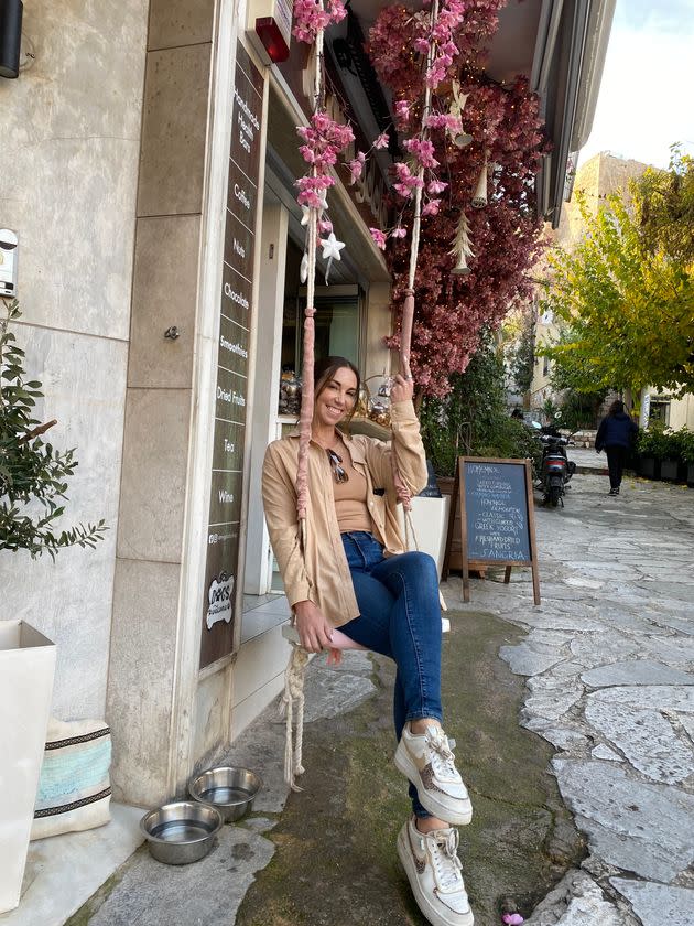 The author outside a coffee shop in Athens, Greece.