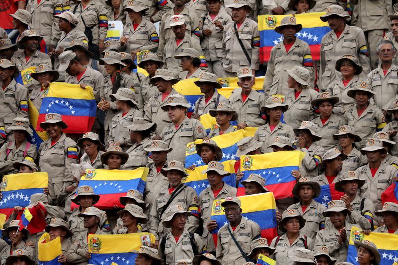 FILE PHOTO: Militia members take part in a rally against the U.S. sanctions on Venezuela, in Caracas