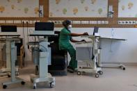 Medical workers treat patients infected with the coronavirus disease (COVID-19) at a hospital in New Delhi