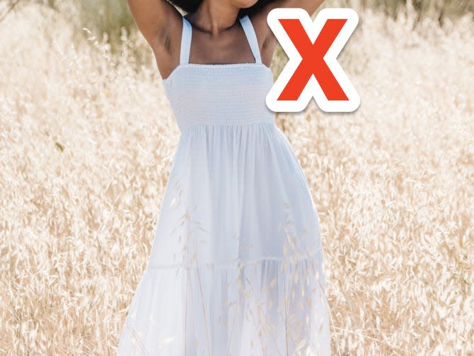 x over woman wearing a white smocked summer dress nap dress in a field