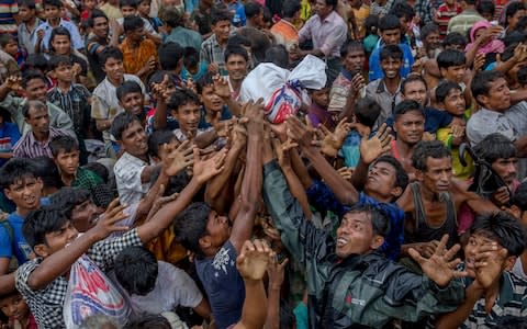 The Rohingya remain dependent on aid in refugee camps - Credit: Dar Yasin/AP