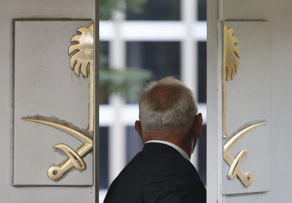 FILE - In this Oct. 22, 2018, file photo, a security guard enters Saudi Arabia's consulate, in Istanbul. The official Saudi statements on the fate of journalist Jamal Khashoggi changed several times since he disappeared after entering his country's consulate in Istanbul on Oct. 2. (AP Photo/Lefteris Pitarakis, File)