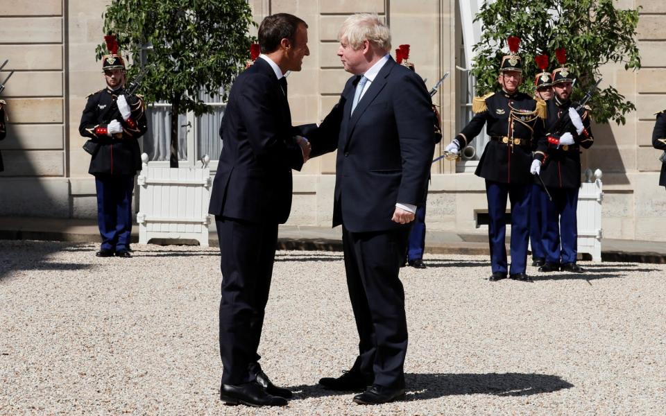 French President Emmanuel Macron welcomes British Prime Minister Boris Johnson before a meeting on Brexit at the Elysee Palace in Paris, France, August 22, 2019 - GONZALO FUENTES/ REUTERS