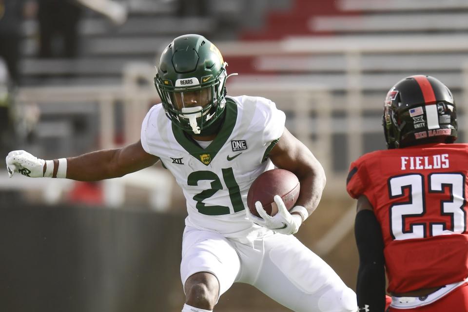 Baylor wide receiver Chateau Reed (21) runs the ball against Texas Tech during an NCAA college football game in Lubbock, Texas, Saturday, Nov. 14, 2020. (AP Photo/Justin Rex)