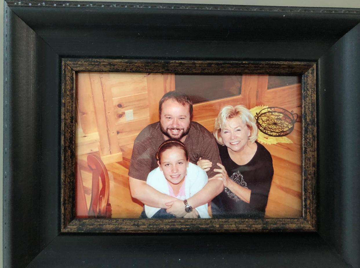 Shane Breedlove and his mother, Carole Cleveland, pose with one of Shane's daughters in an undated photo. Breedlove was shot and killed while walking on Washington Avenue on July 19, 2015.