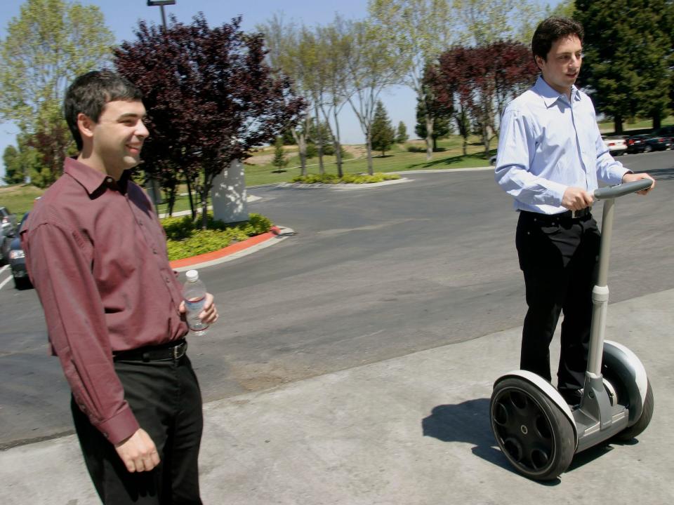 Larry Page (left) and Sergey Brin take a stroll on Google's campus in Mountain View, California, in 2003.