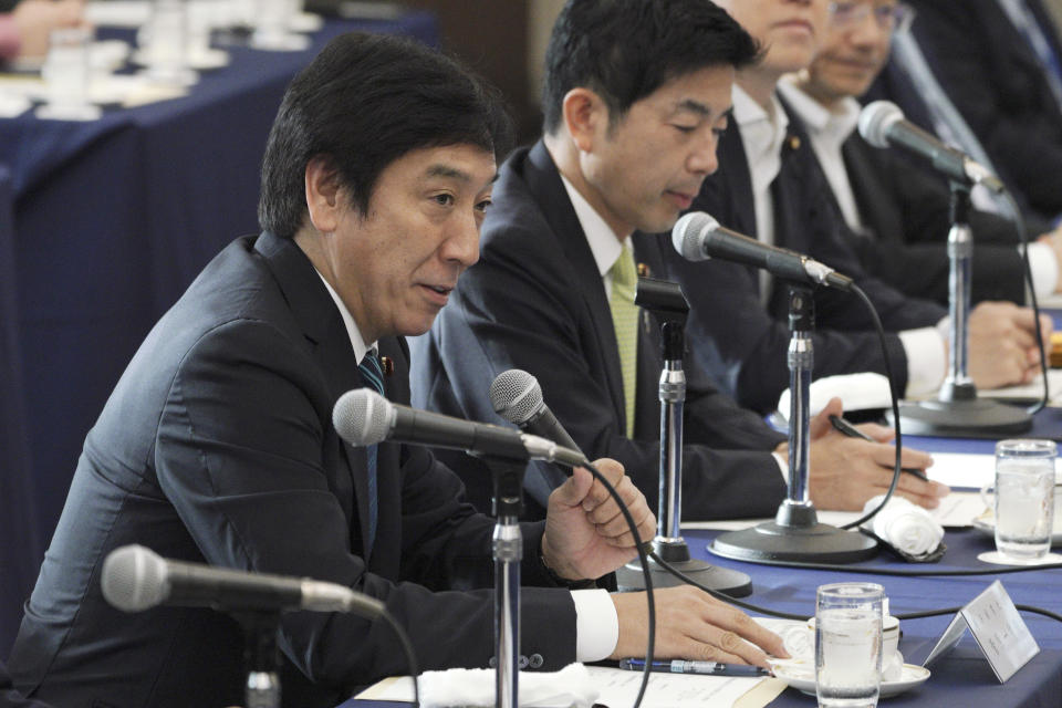 Japanese Trade Minister Isshu Sugawara speaks to the group of the Japanese automakers chiefs during a meeting Thursday, Sept. 26, 2019, in Tokyo. The U.S. and Japan on Wednesday signed a limited trade deal that will eliminate tariffs and expand market access on farm, industrial and digital products. But the deal does not address autos, a key sticking point during months of contentious negotiations, and President Donald Trump indicated the two countries were still working on a broader agreement. (AP Photo/Eugene Hoshiko)