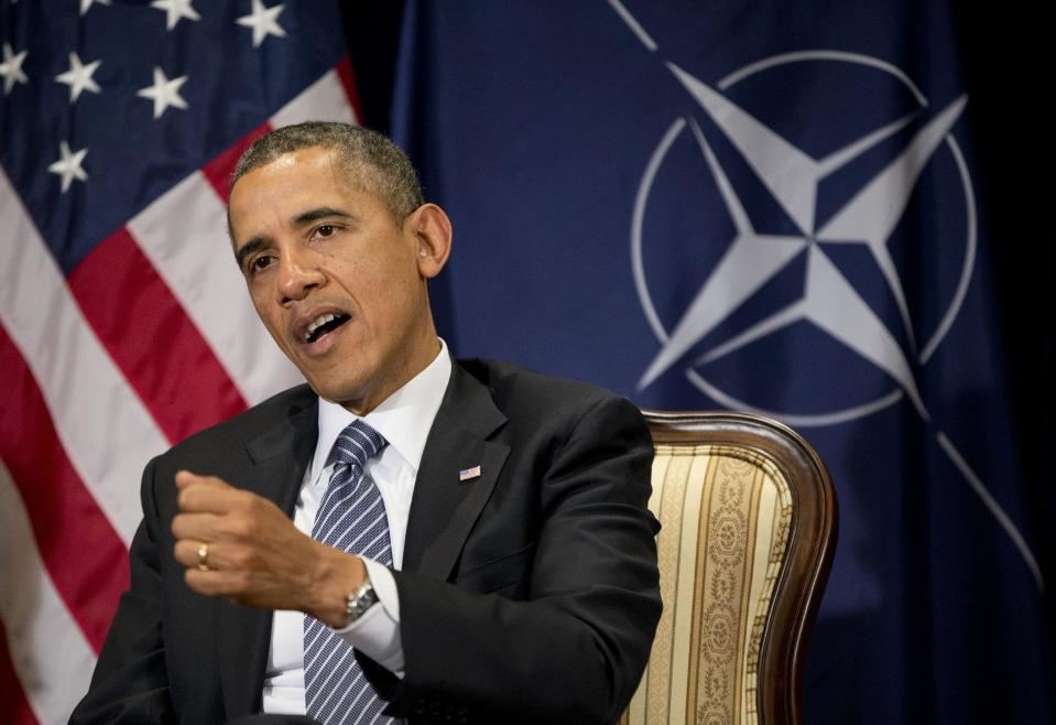 President Barack Obama meets with NATO Secretary General Anders Fogh Rasmussen in Brussels, Belgium, Wednesday, March 26, 2014. Obama is on a one day trip to Belgium to shore up commitments he received from allies in The Hague, Netherlands, to reassure Eastern Europeans members of NATO that the alliance will stand by them and to make a larger point about European security a quarter-century after the fall of the Iron Curtain. (AP Photo/Pablo Martinez Monsivais) (AP Photo/Pablo Martinez Monsivais)