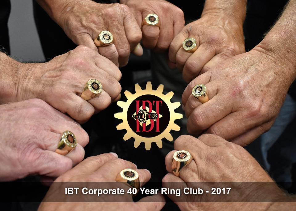 IBT Industrial Solutions staff show their rings commemorating 40 years with the Kansas-based company.