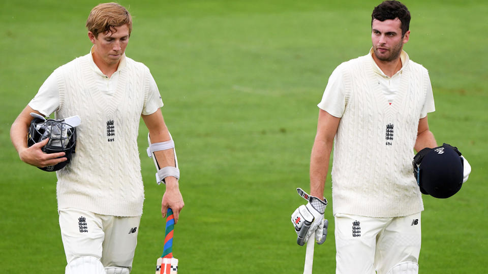 Zak Crawley and Dom Sibley, pictured here leaving the field after rain stopped play.