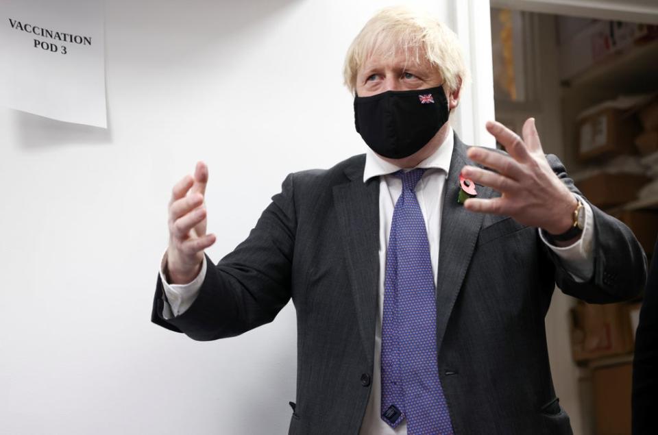 Prime Minister Boris Johnson visits a Covid-19 vaccination centre at a pharmacy in Sidcup (Henry Nicholls/PA) (PA Wire)