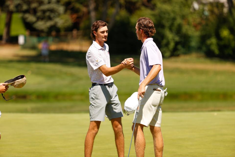 Nick Gabrelcik (left) shakes hands with Jackson Van Paris after Gabrelcik won his first-round U.S. Amateur match 2 and 1 on Wednesday at the Cherry Hills Country Club in Cherry Hills Village, Colo.