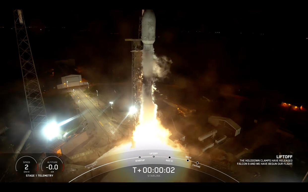  a black and white spacex falcon 9 rocket launches at night 