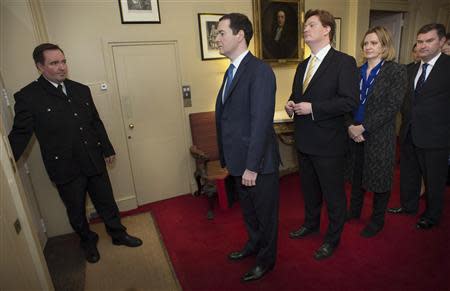 Britain's Chancellor of the Exchequer George Osborne (2nd L) leads his Treasury team as they prepare to leave number 11 Downing Street to pose for photographers before going to the House of Commons to present the Budget, in central London March 19, 2014. REUTERS/Stefan Rousseau/pool