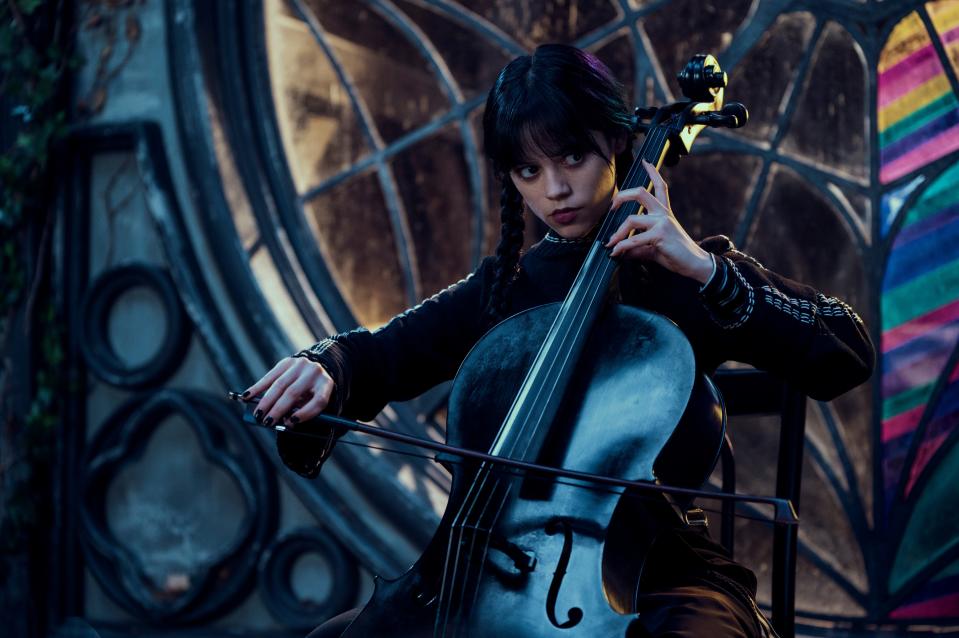 Jenna Ortega's Wednesday Addams playing a stringed instrument in Netflix's Wednesday. (Netflix)