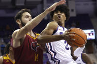 TCU guard PJ Haggerty (3) goes to the basket as Louisiana-Monroe forward Victor Bafutto (14) defends during the first half of an NCAA college basketball game Thursday, Nov. 17, 2022, in Fort Worth, Texas. (AP Photo/Ron Jenkins)