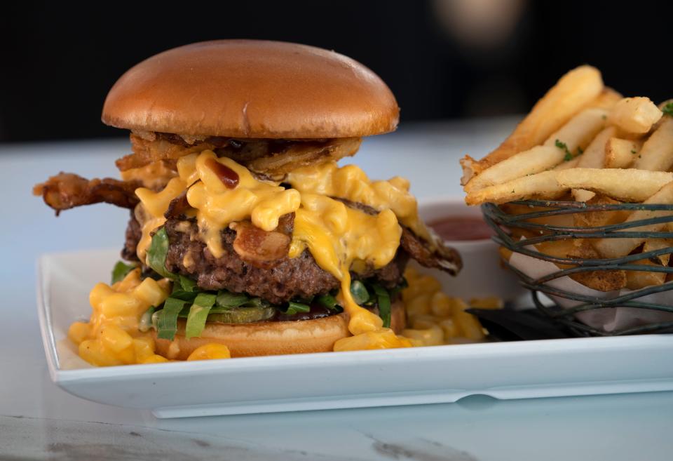 The Big Cheesy is a monster burger at Sugar Factory during opening weekend Saturday, April 16, 2022 in downtown Indianapolis.