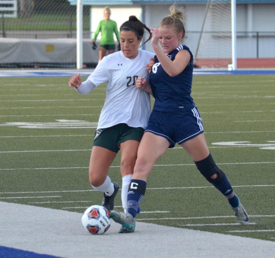 Zeeland West's Tia Martinez fights for a ball against St. Joseph on Wednesday at Battle Creek Harper Creek.