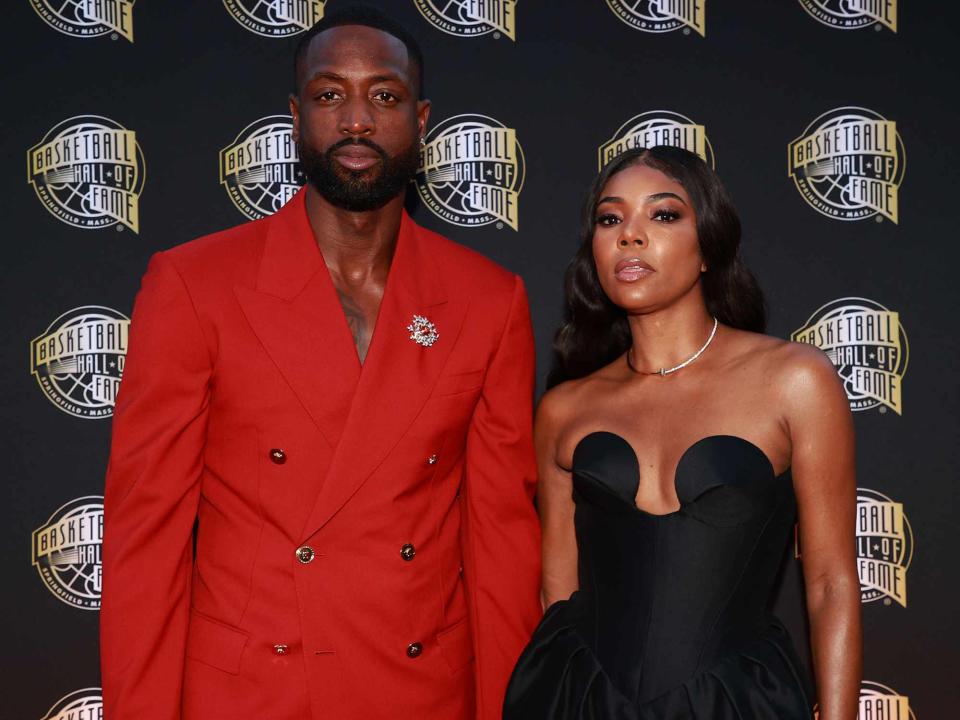 <p>Mike Lawrie/Getty</p> Dwyane Wade and Gabrielle Union attend the 2023 Naismith Basketball Hall of Fame Induction