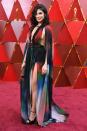 <p>Lebanese actress Rita Hayek flashed sideboob and side leg in a rainbow dress. (Photo credit should read ANGELA WEISS/AFP/Getty Images) </p>