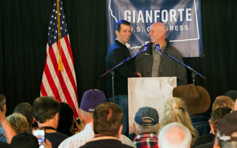  Republican Greg Gianforte, right, welcomes Donald Trump Jr. - Credit: Bobby Caina Calvan/AP