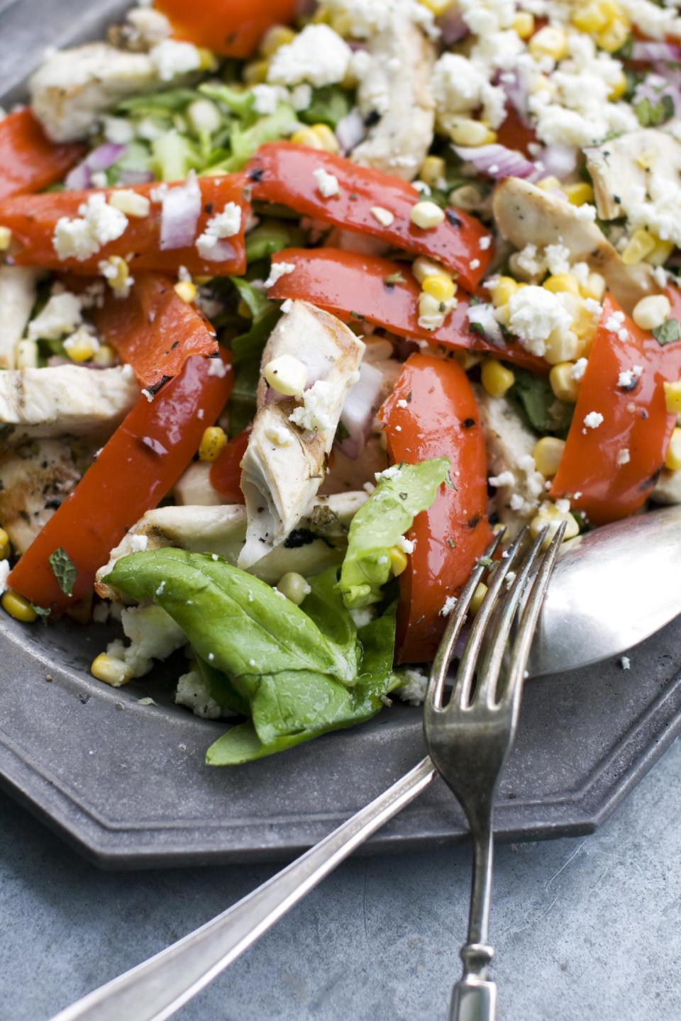 In this image taken on May 20, 2013, grilled Greek chicken salad is shown on a serving platter in Concord, N.H. (AP Photo/Matthew Mead)