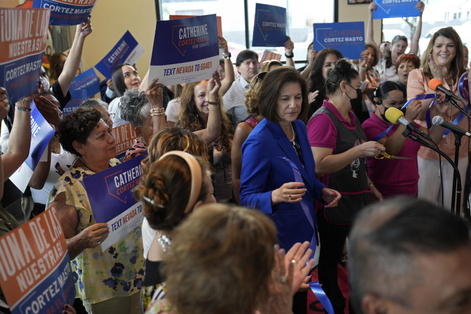 U.S. Sen. Catherine Cortez Masto, D-Nevada, is surrounded by supporters as she attends a campaign event at a Mexican restaurant on Aug. 12, 2022, in Las Vegas. (John Locher / AP)