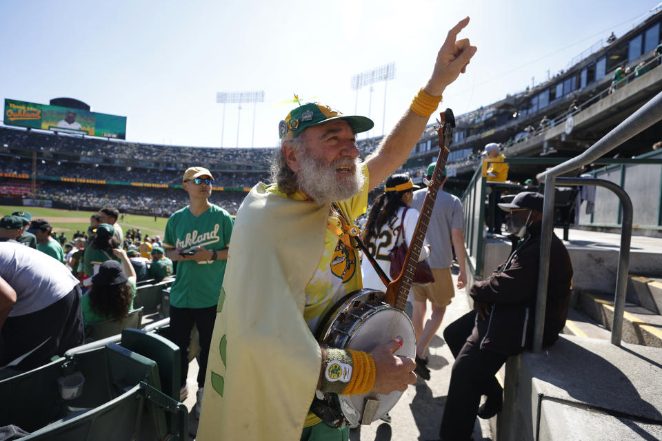 OAKLAND, CA – SEPTEMBER 26: A fan plays the banjo before the game between the Texas Rangers and the Oakland Athletics at RingCentral Coliseum on Thursday, September 26, 2024 in Oakland, California. (Photo by Lachlan Cunningham/MLB Photos via Getty Images)