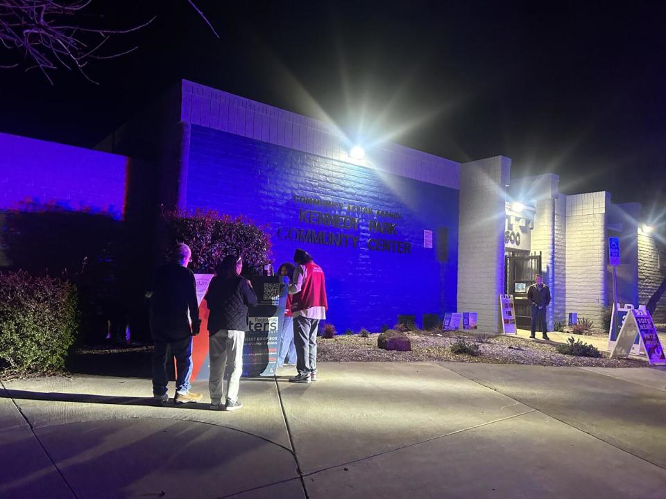 Jim Hicks, far right, stands watch at the Kennedy Park Community Center in Stockton on March 5