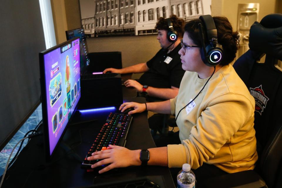 Nevaeh Diaz, front, and Tucker Haynes utilizes two of the five Contender Esports gaming setups at Vib Best Western Springfield on Thursday, Dec. 15, 2022. The setups were unveiling during the launch of the Springfield Esports Coalition.