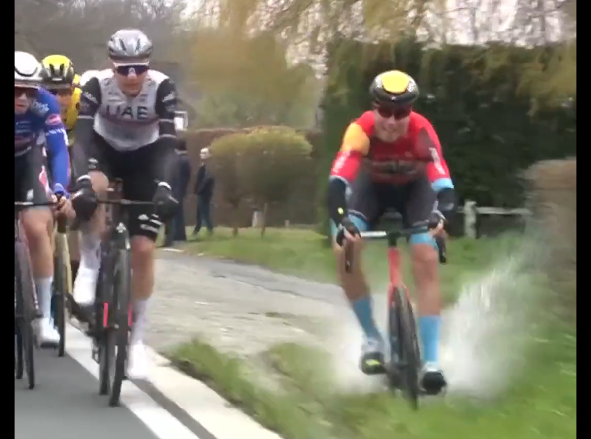 Filip Maciejuk loses control riding through a puddle on a grass verge (Eurosport)