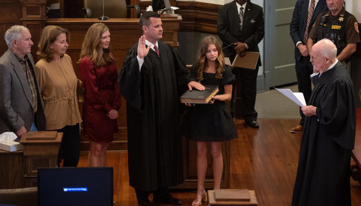 Brad Touchstone, center, was sworn in as 15th Circuit Judge, Friday, Jan. 27, 2023, at the Lamar County Courthouse. Fellow 15th Circuit Judge Prentiss Harrell presided over the investiture. Touchstone's daughter Ryleigh holds the Bible as his wife and parents look on.