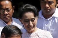 Myanmar's National League for Democracy party leader Aung San Suu Kyi leaves her party headquarters after talking to supporters about the general elections in Yangon, Myanmar November 9, 2015. REUTERS/Jorge Silva