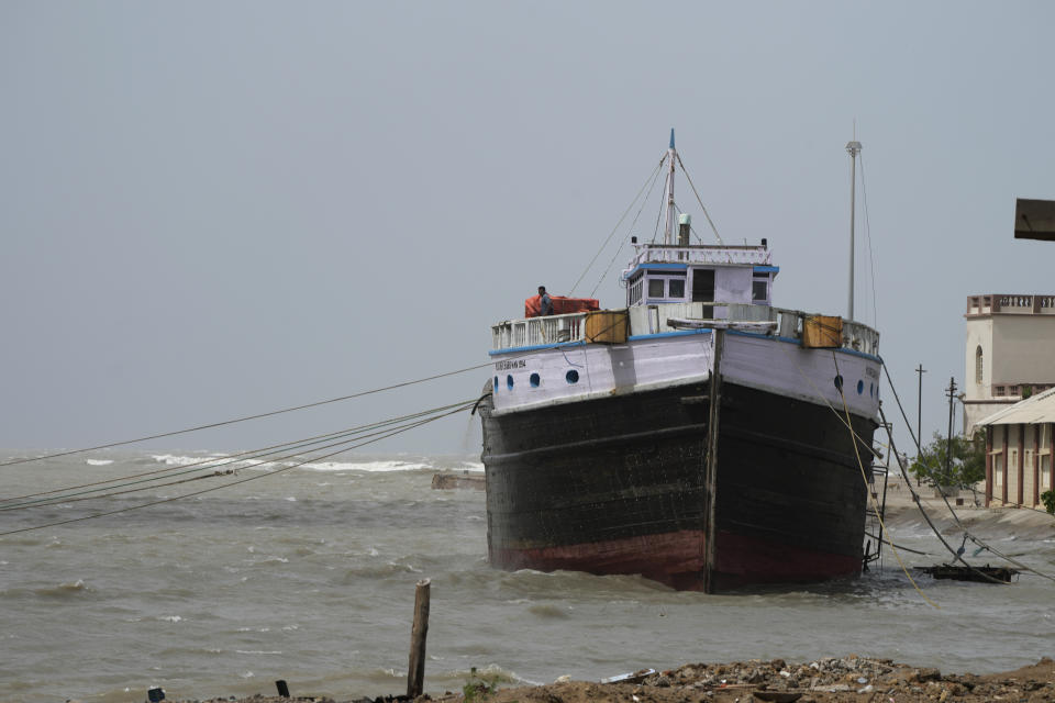 A boat is anchored at Mandvi on the Arabia Sea coast in Kutch district of Gujarat state, India, Wednesday, June 14, 2023. With Cyclone Biparjoy expected to make landfall Thursday evening, coastal regions of India and Pakistan are on high alert. (AP Photo/Ajit Solanki)