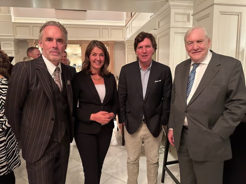 Alberta Premier Danielle Smith (second from left) shares a picture with three men she shared the stage with at events in Calgary and Edmonton on Wednesday: author Jordan Peterson, U.S. broadcaster Tucker Carlson and former newspaper magnate Conrad Back.