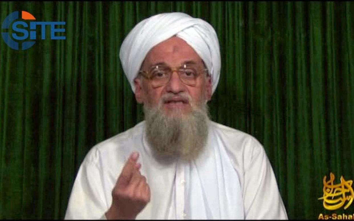 Al-Qaeda's chief Ayman al-Zawahiri, seen here in an earlier 2012 video, called for a united jihad in Kashmir  - AFP