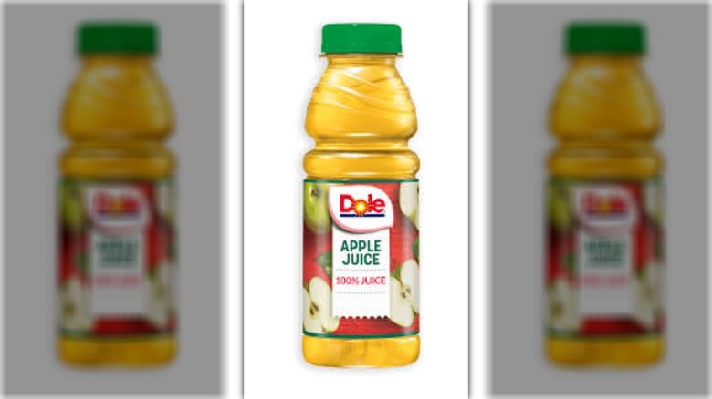 Three bottles of apple juice