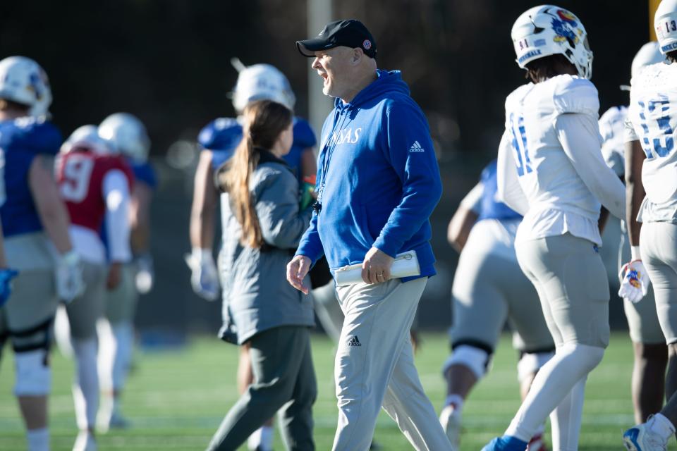 Kansas football defensive coordinator Brian Borland looks on during warmups at an outdoor practice on April 4, 2024 in Lawrence.