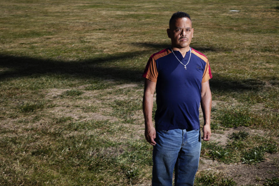 A plane casts a shadow behind Miguel Alarcon in Hillview Park in East San Jose. (John Brecher / for NBC News)