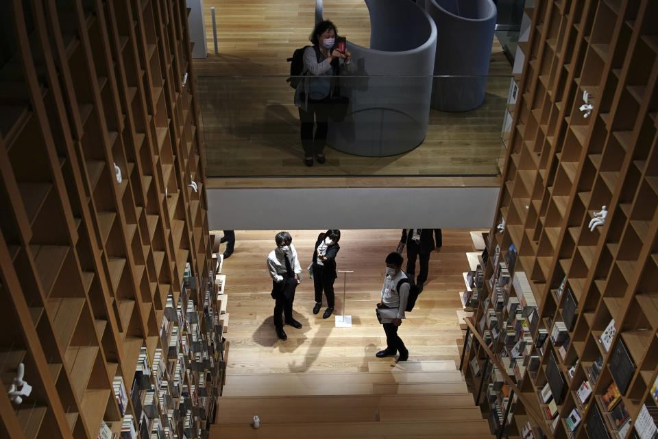 Journalists visit the university's new international house of literature as known as The Haruki Murakami Library at Waseda University Wednesday, Sept. 22, 2021 in Tokyo. The new literary center opening next month on the university campus is no ordinary kind. It's designed by renowned Japanese architect Kengo Kuma and featuring the world of Murakami and his works. (AP Photo/Eugene Hoshiko)