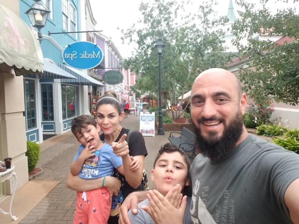 Saif takes a picture with Noora, Yazin and Nezar. Saif said one of his favorite memories of Noora is when she smiles while helping their children. She did everything with joy, he said. Provided by Saif Mhadi