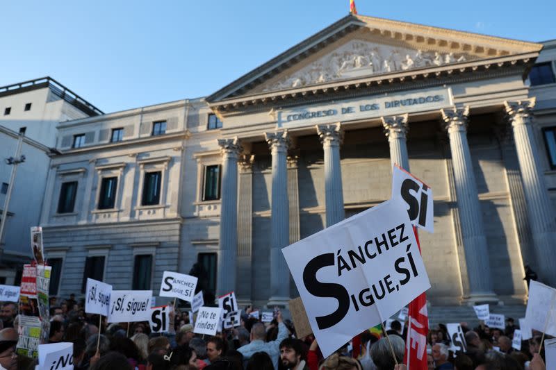 People march to show support for Spain's PM Sanchez, in Madrid