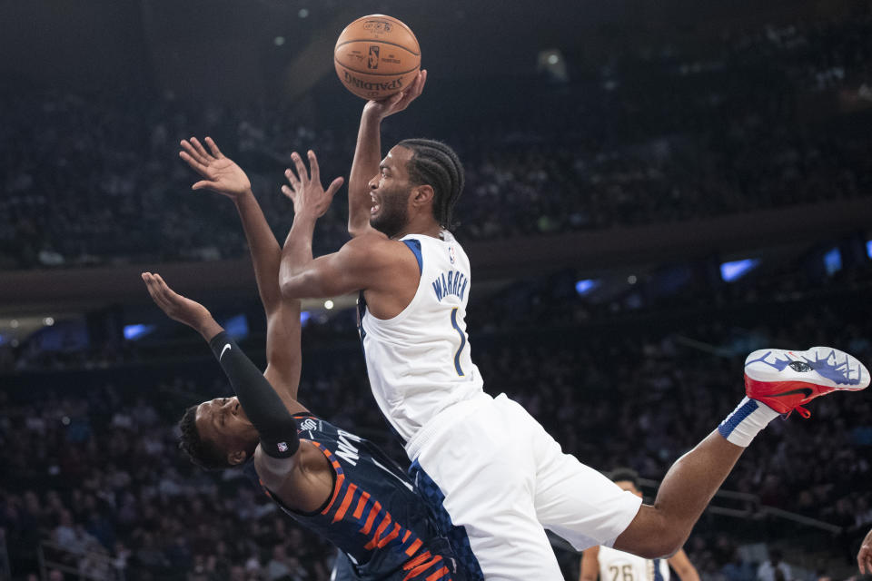 Indiana Pacers forward T.J. Warren (1) goes to the basket against New York Knicks guard Frank Ntilikina (11) in the first half of an NBA basketball game, Saturday, Dec. 7, 2019, at Madison Square Garden in New York. (AP Photo/Mary Altaffer)