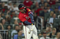 Atlanta Braves' Travis d'Arnaud hits a grand slam against the Texas Rangers during the sixth inning of a baseball game Friday, April 19, 2024, in Atlanta. (Jason Getz/Atlanta Journal-Constitution via AP)